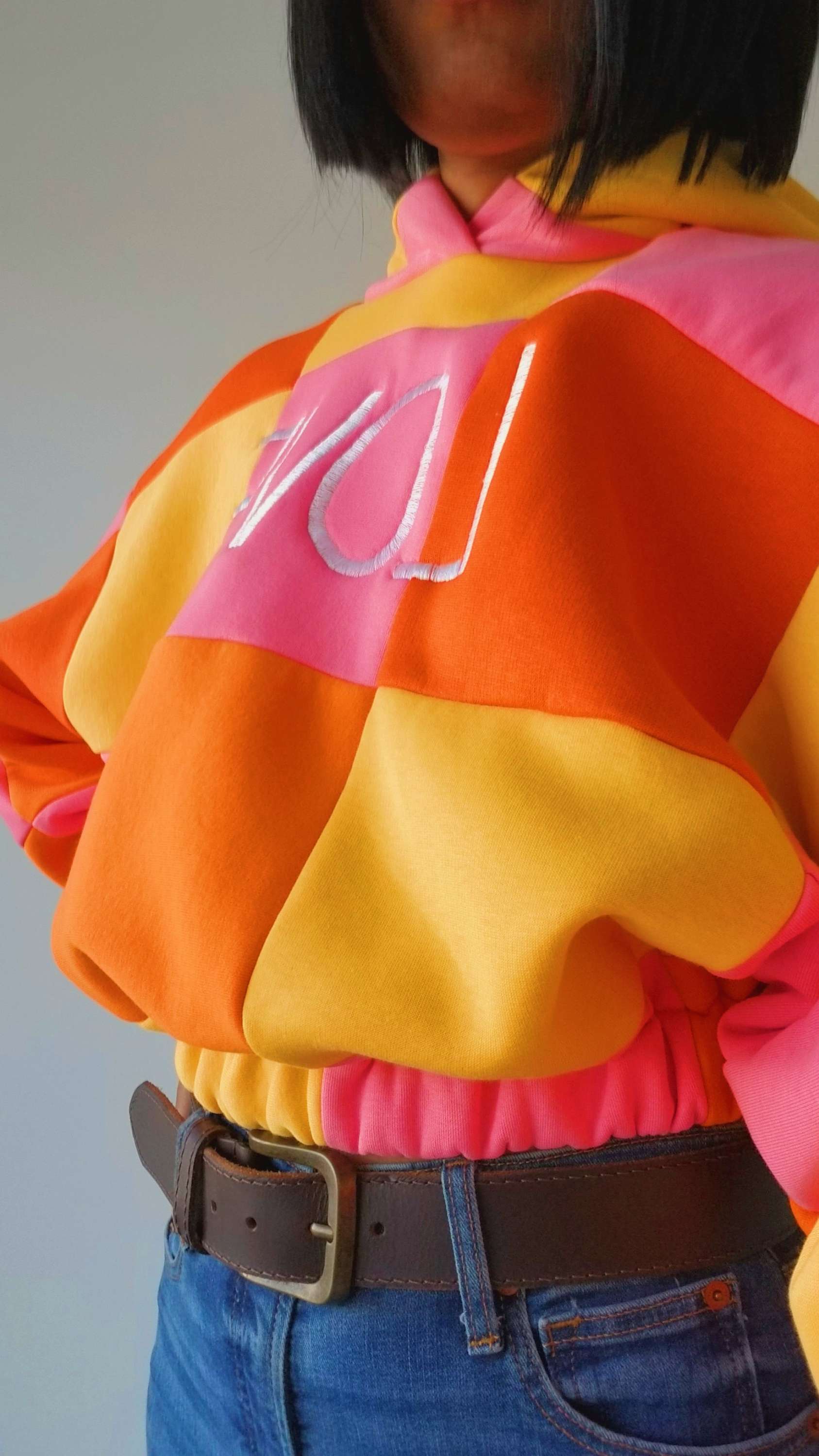 close up view of yellow hoodie