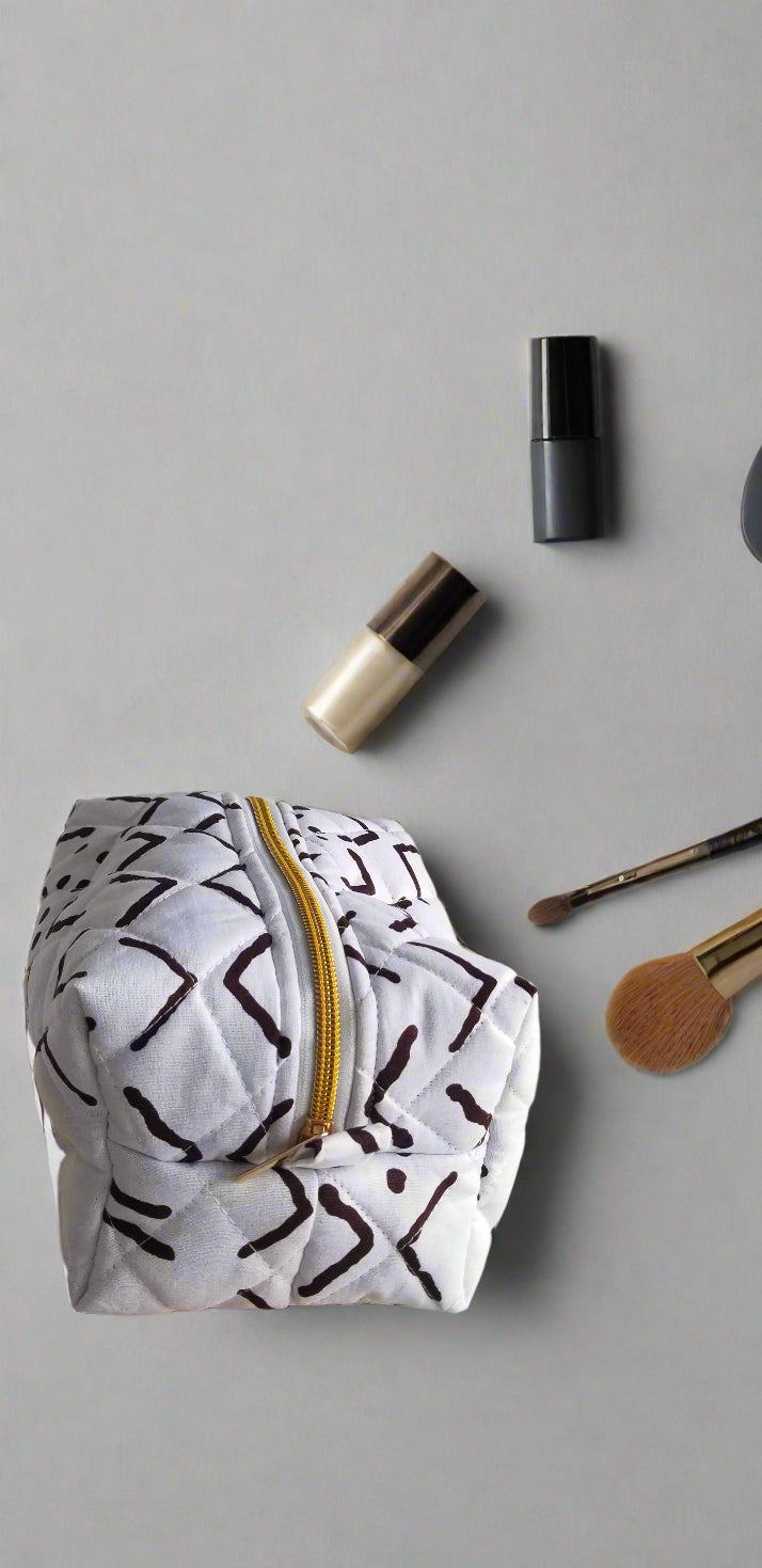 Close-up detail of the intricate black and white geometric artisan print on the Scope and Flow Ethereal makeup bag.