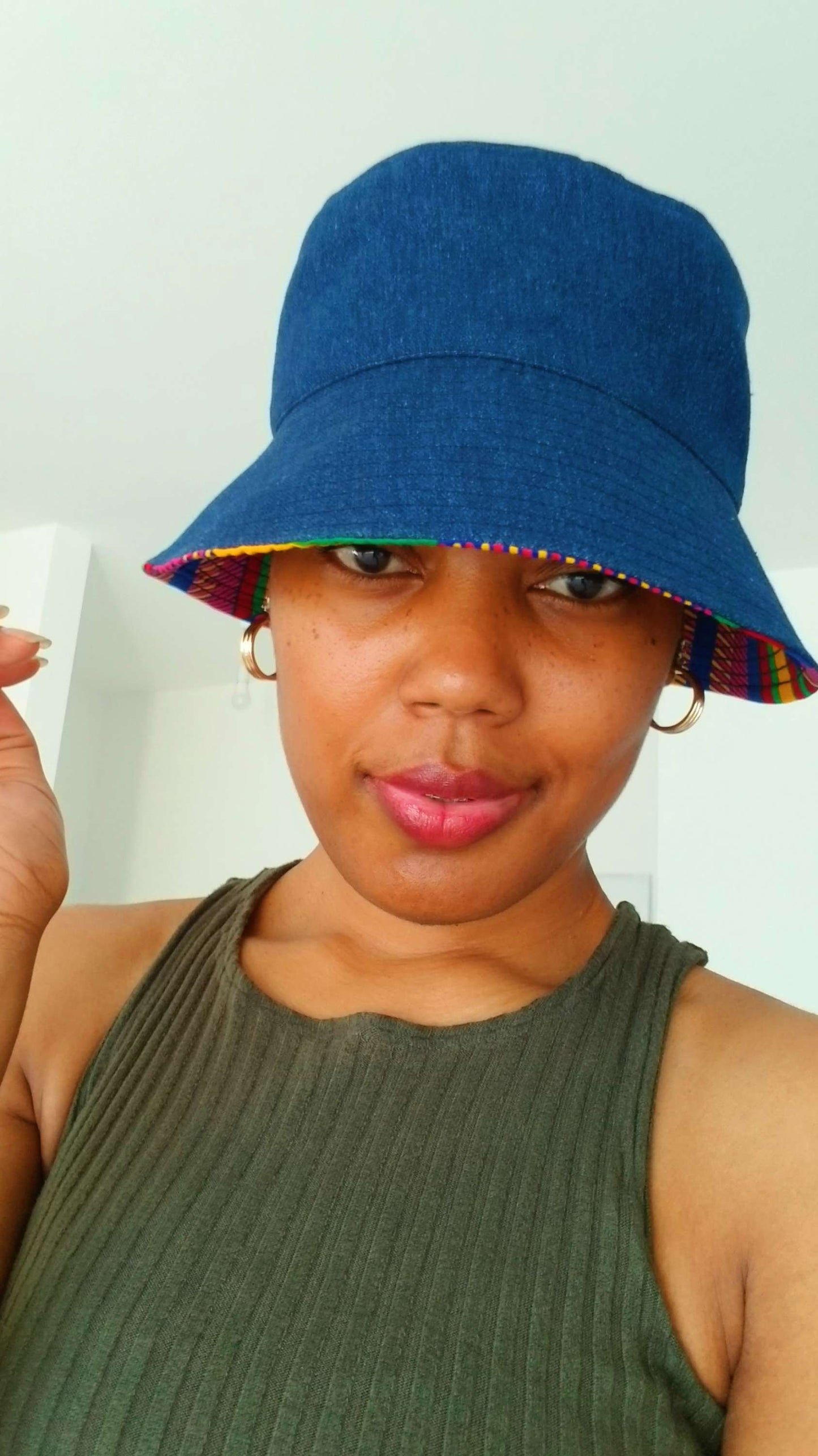 Close-up detail of the premium indigo tribal fabric and high-quality stitching on the reversible bucket hat.