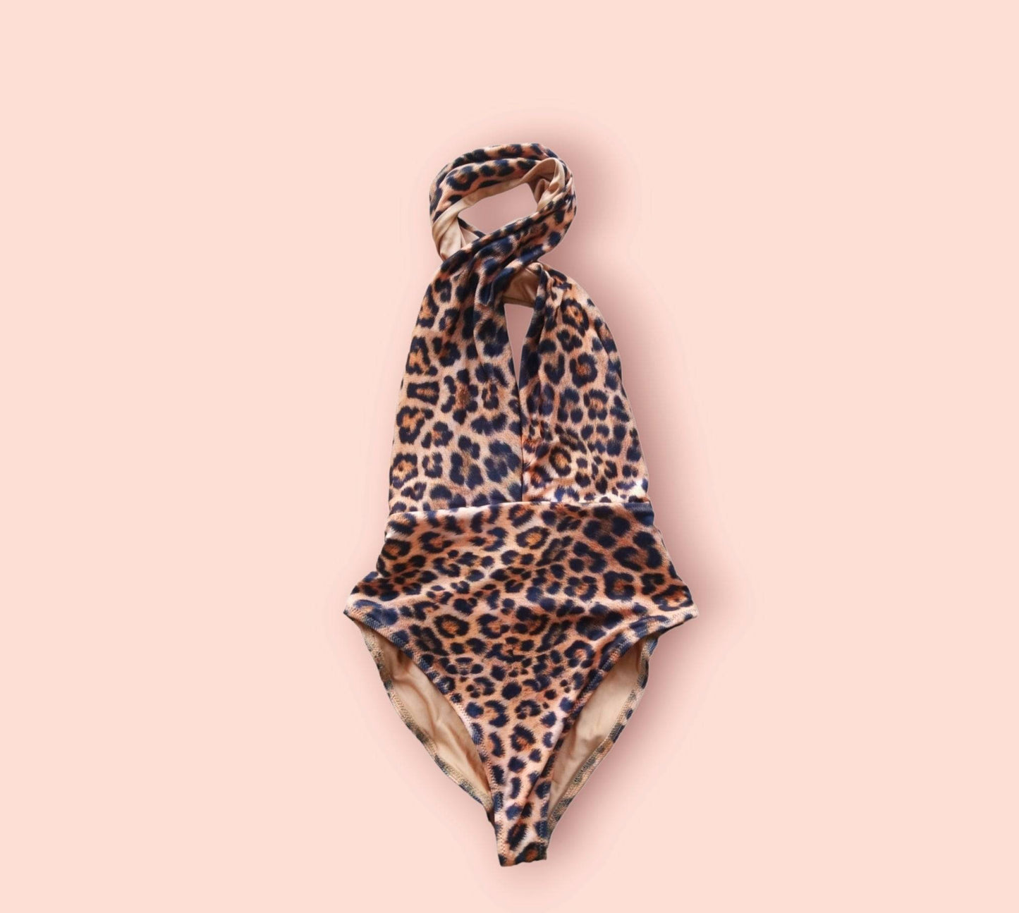 Close-up of the premium leopard print and high-quality stitching on the handcrafted Midnight Leopard one-piece.