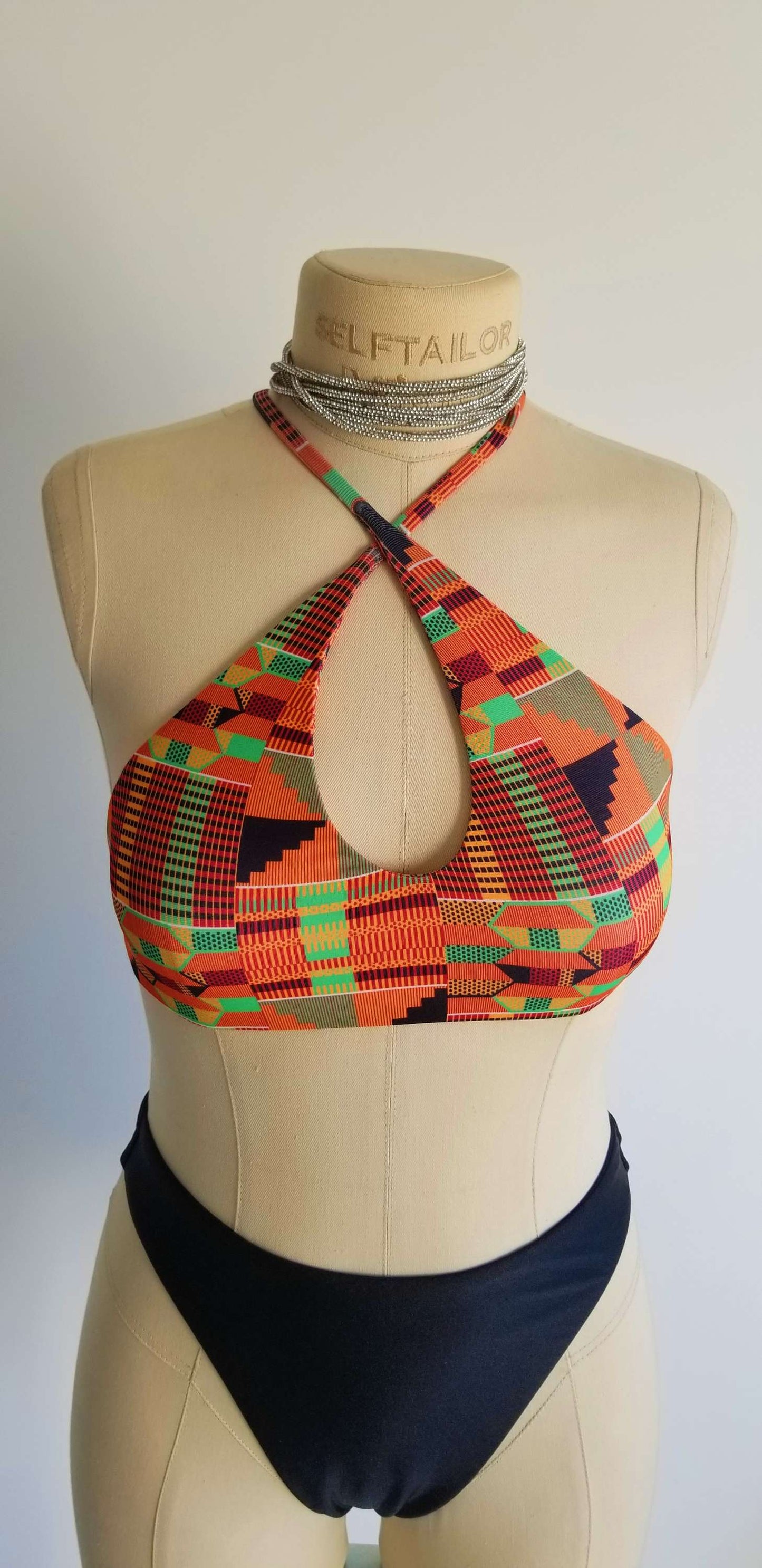 Front view of the handcrafted black Noir Essential bikini bottoms showing the clean lines and mid-rise waist.