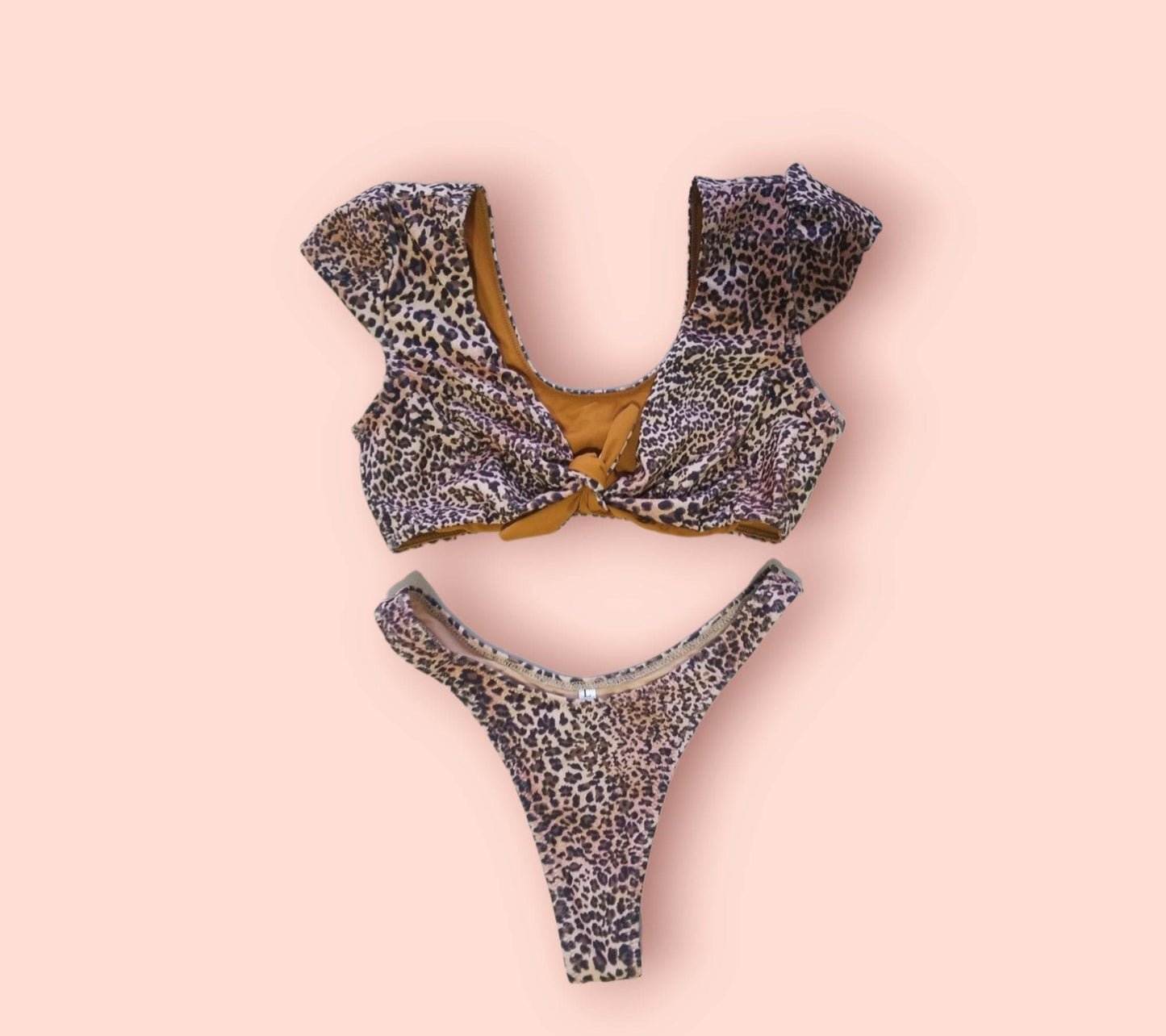 Close-up of the premium leopard print fabric and high-quality tie details on the handcrafted Sahara bikini set.