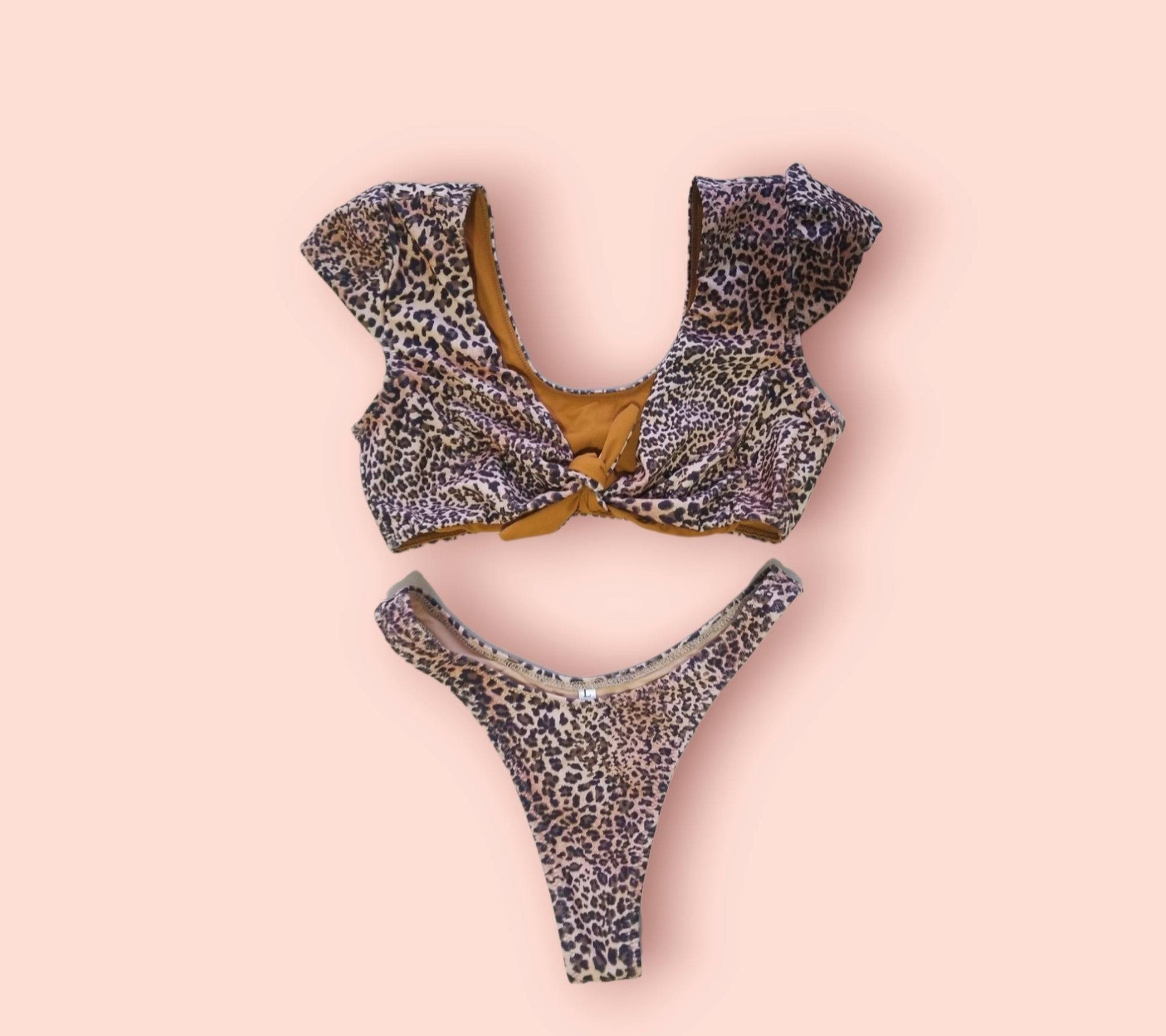 Close-up of the premium leopard print fabric and high-quality tie details on the handcrafted Sahara bikini set.