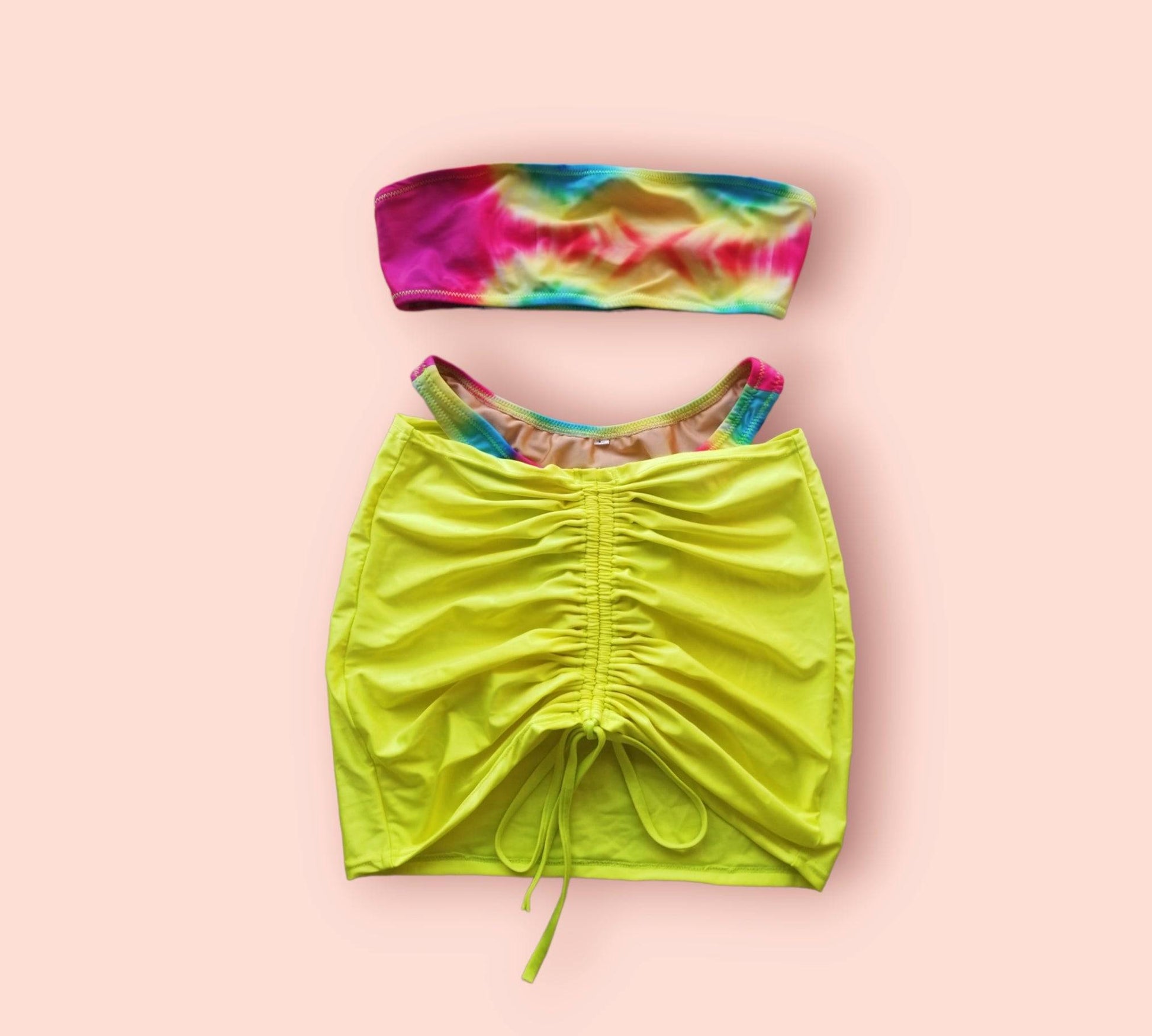 A vibrant neon green swim skirt made of high-stretch swimsuit fabric with an adjustable waist tie.