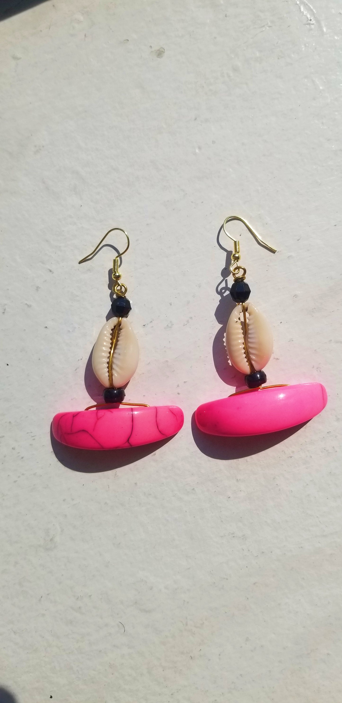 Soft blush pink resin drop earrings, handcrafted for a feminine, sculpted aesthetic.