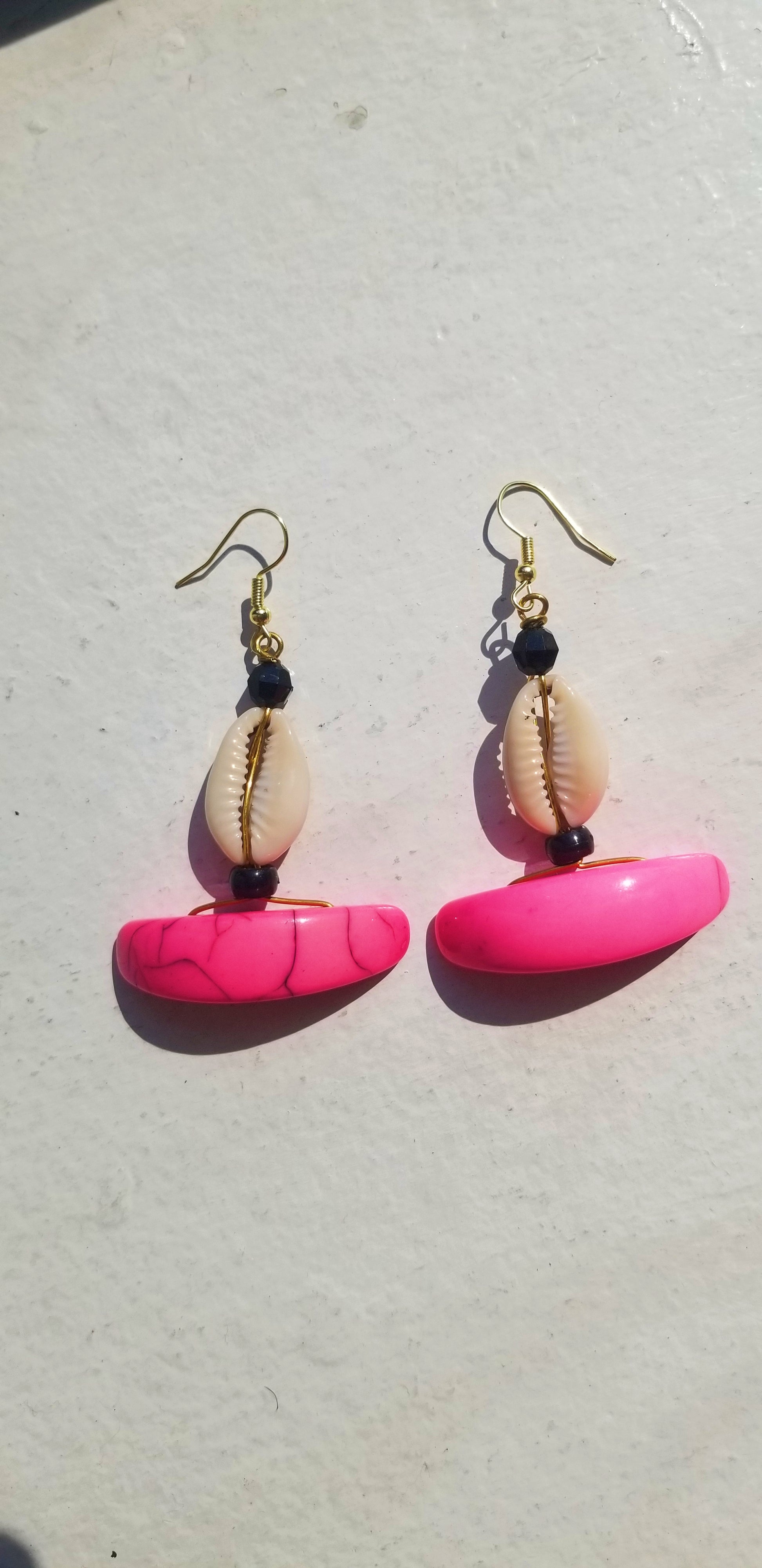 Soft blush pink resin drop earrings, handcrafted for a feminine, sculpted aesthetic.
