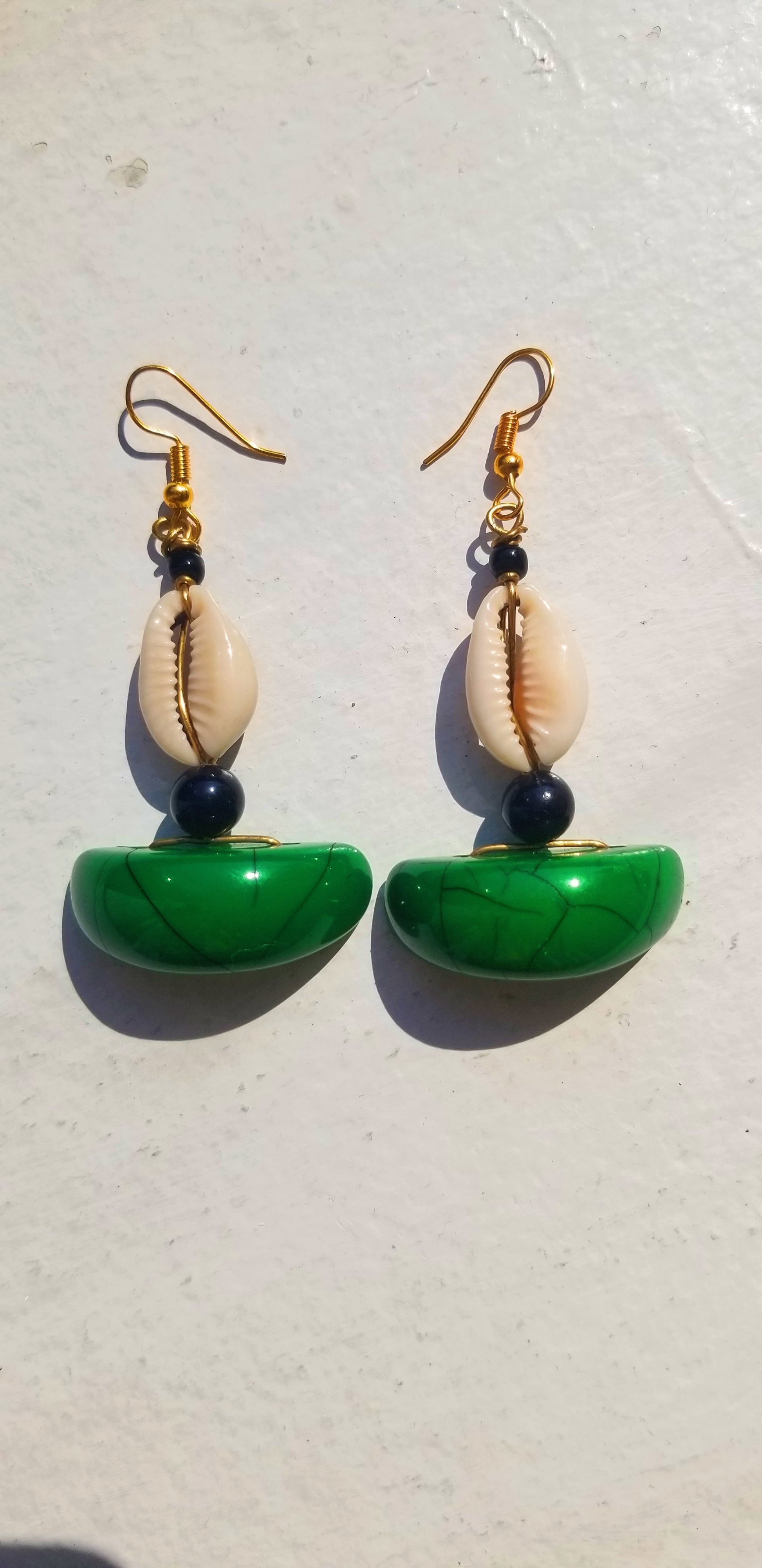 Scope and Flow Zora earrings in a deep architectural emerald green resin and natural shell.